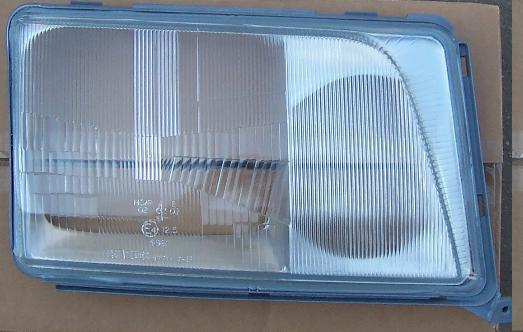 Мерседес W124 стекло фары правое с рамкой